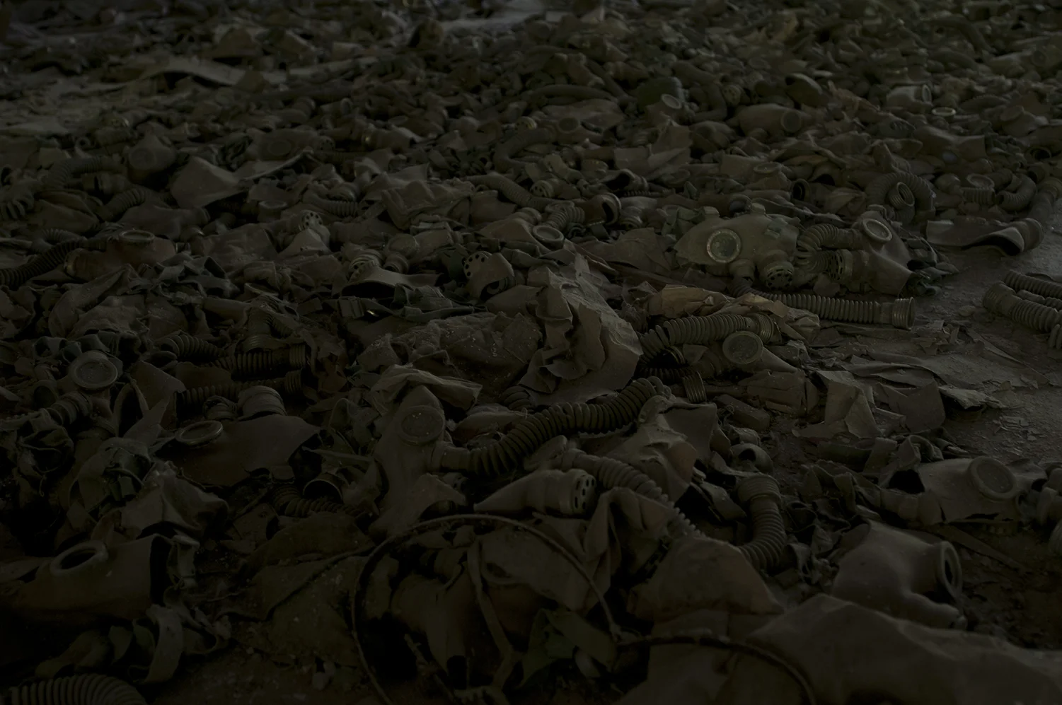 Children size gas masks displayed on the ground of Pypiat's school. None of those masks were used or have been brought here during the catastrophe 