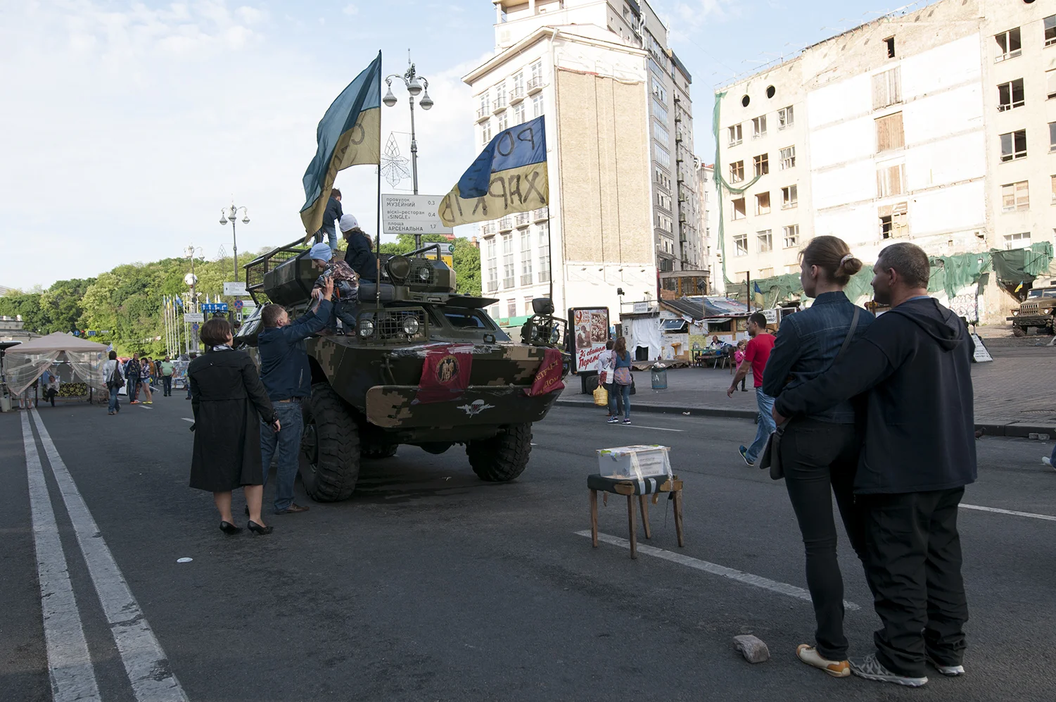 Kids playing on an immobilized APC, Maidan