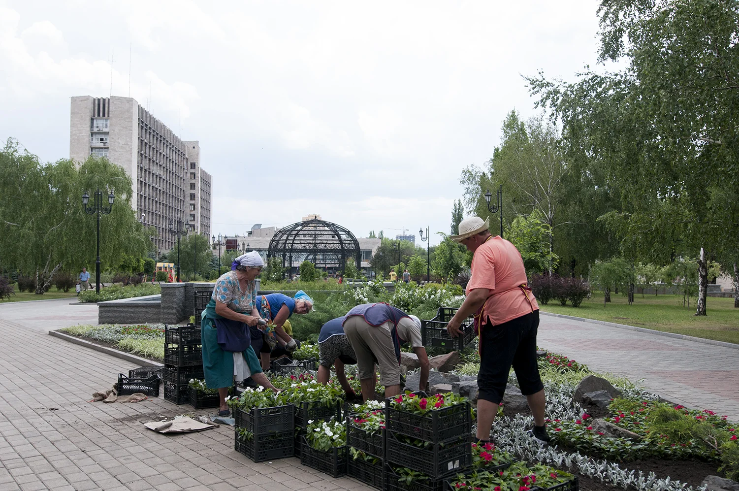 City workers gardening behind the ODA as the Vostok Battalion start to take over the building