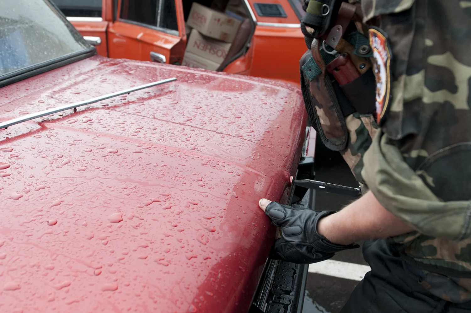 Soldier trying to break the trunk's lock