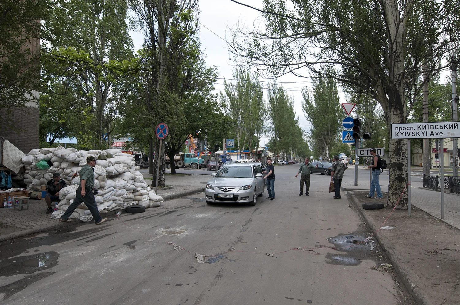 Unarmed guards controlling a car at the checkpoint 