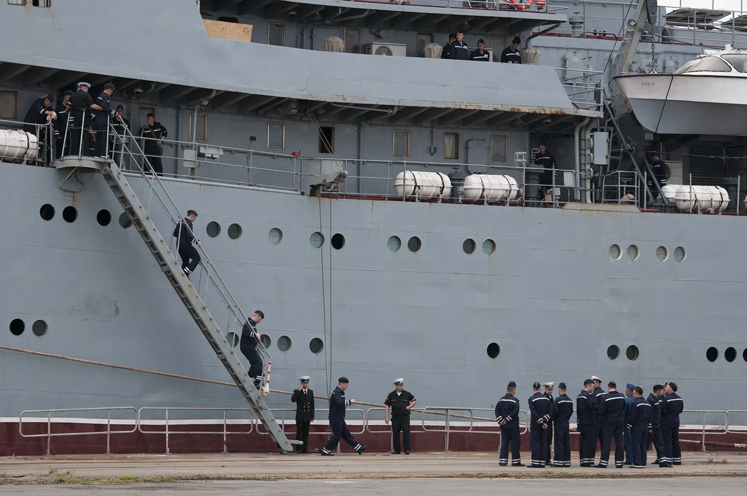 Russian sailors disembarking in Saint Nazaire to start their training on the Vladivostok, the first of the two Mistral warships sold by the French government to Russia . Its delivery is set for the last quarter of this year.