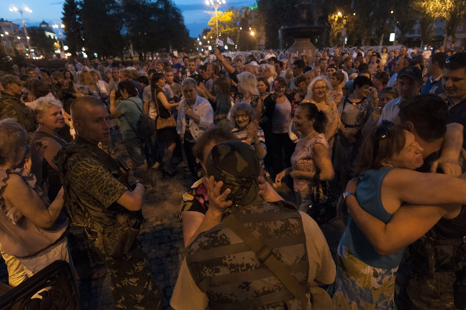 Separatits soliders being kissed and huged by women 