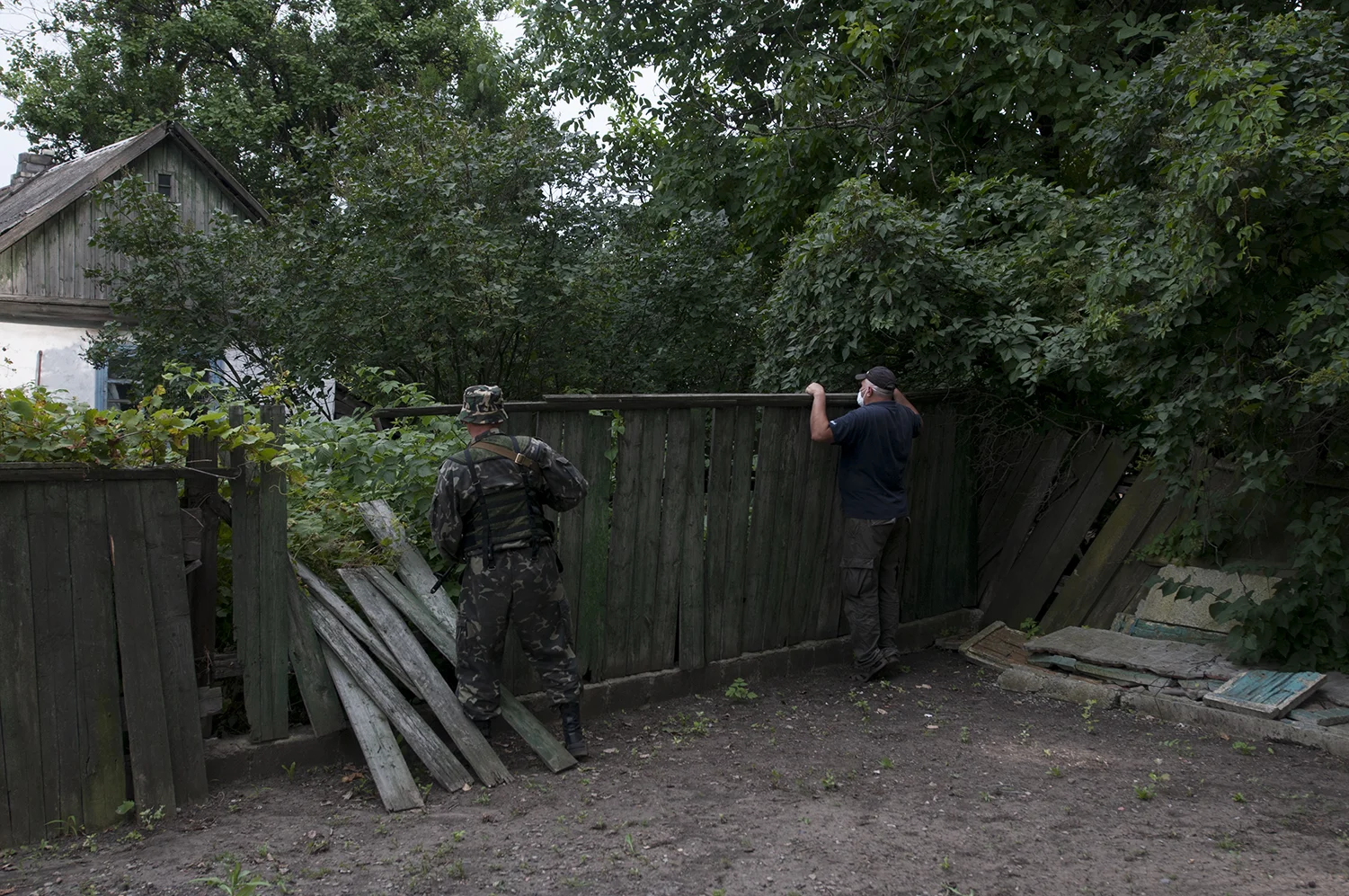 A separatist and a civilian looking checking the garden from which a really strong smell was coming out