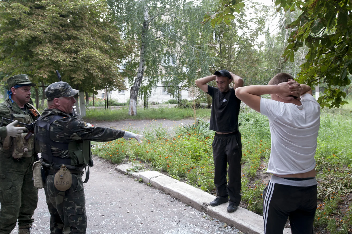 Separatist ordering looters they just arrested inside the same building to get down on their knees