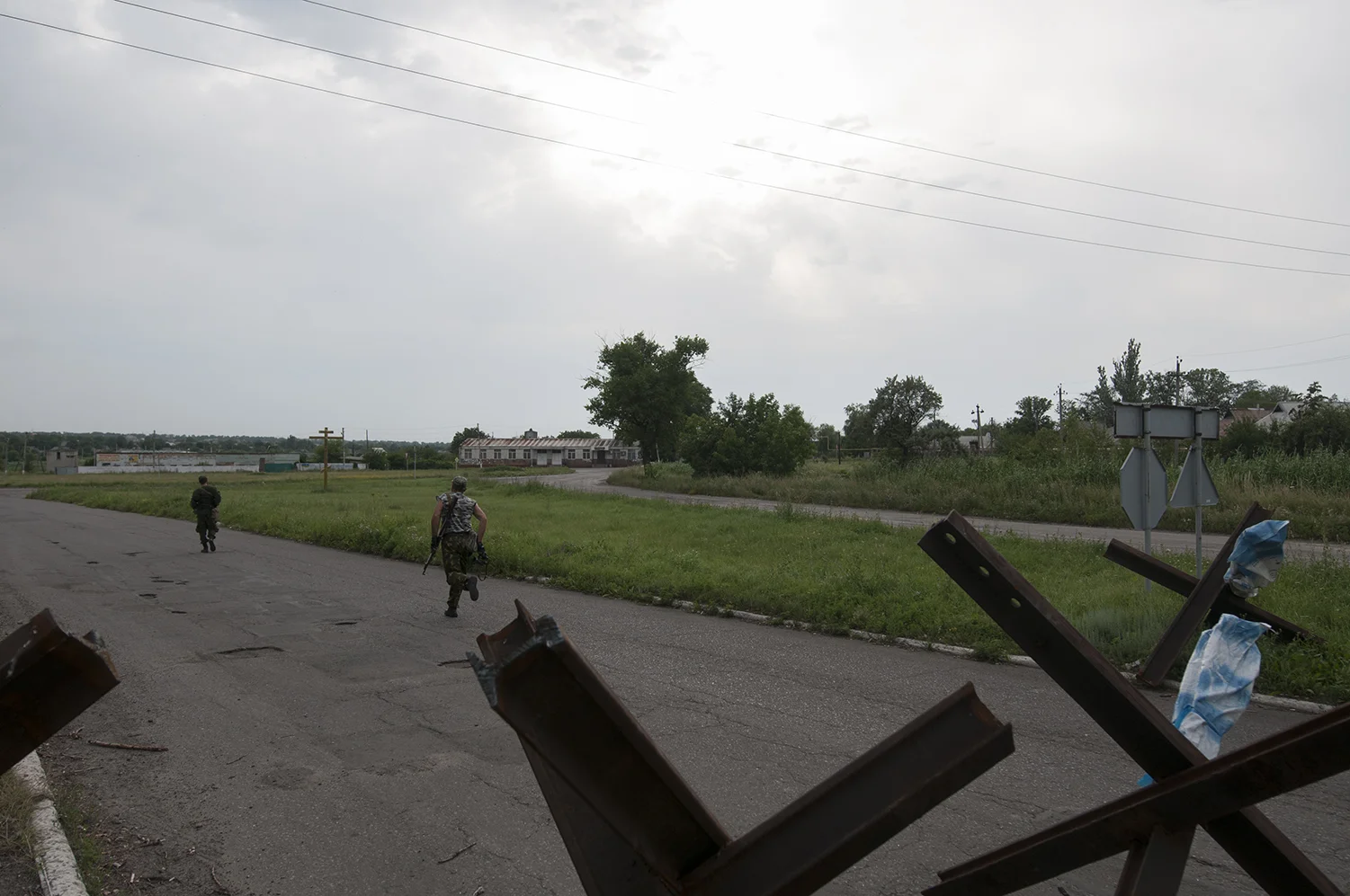 Soldiers running from a checkpoint to observe some suspicious movements, it later happened to be a false alarm 