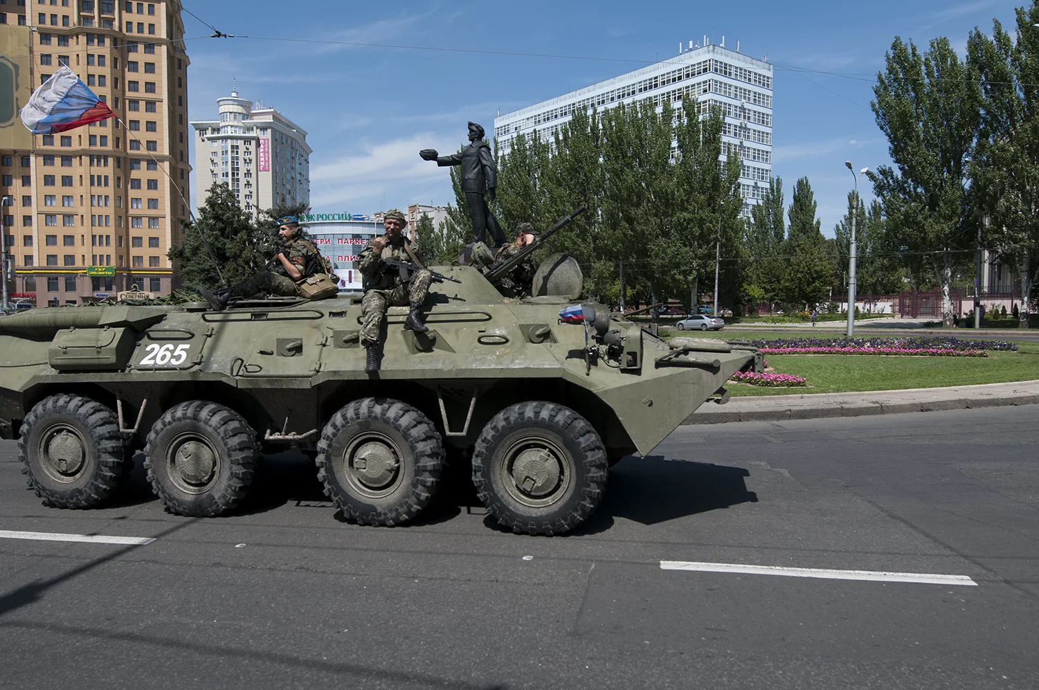 Armed APC driving back from the train staion