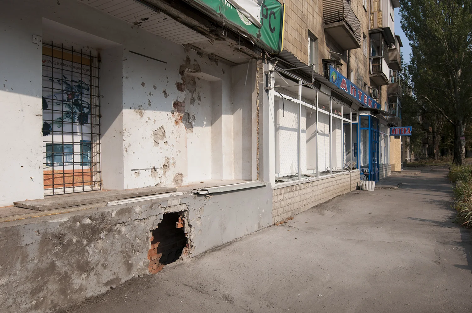 Store damaged by the blast of a shell