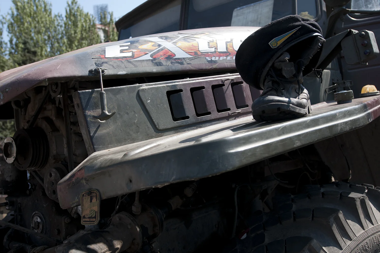 Ukrainian beret and a patch nailed onto a transport truck.