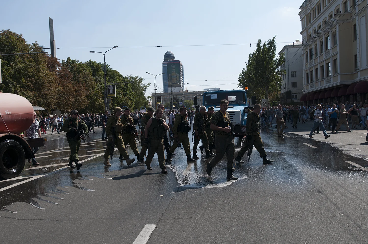 Pro-Russian rebels walking carelessly after their prisoners 