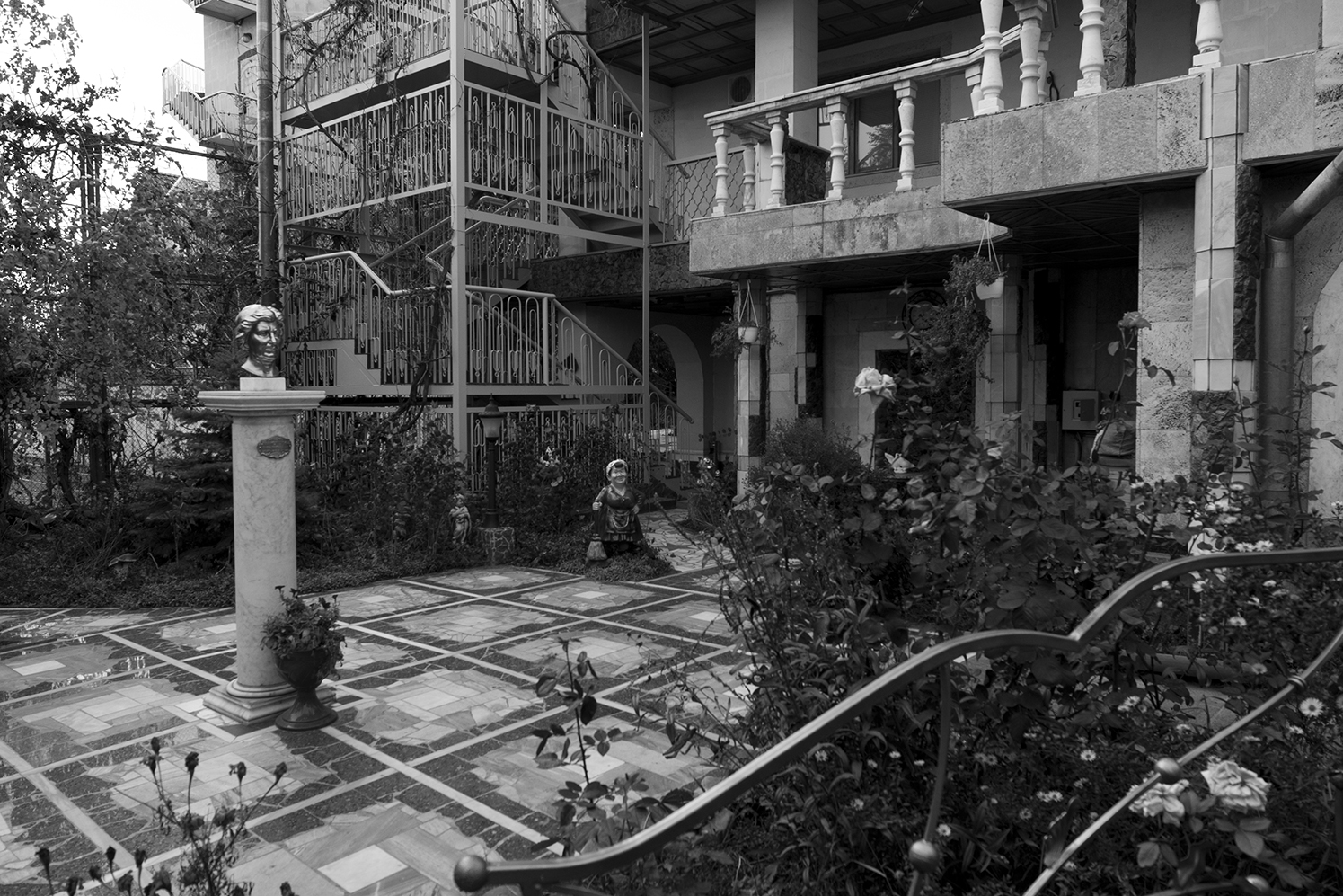 Mansion's courtyard where the fictive Tiraspol Hostel is located. The place is hosting young children from Gagauzia training to become tennis-men. In the premises of the propriety a big tower called the Bottle Museum can be found, this building allegedly containing a vast wine collection but which doesn't seem to be open to the public. 