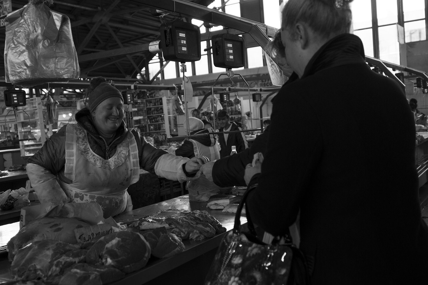 Butcher selling meat at the open market of Bender