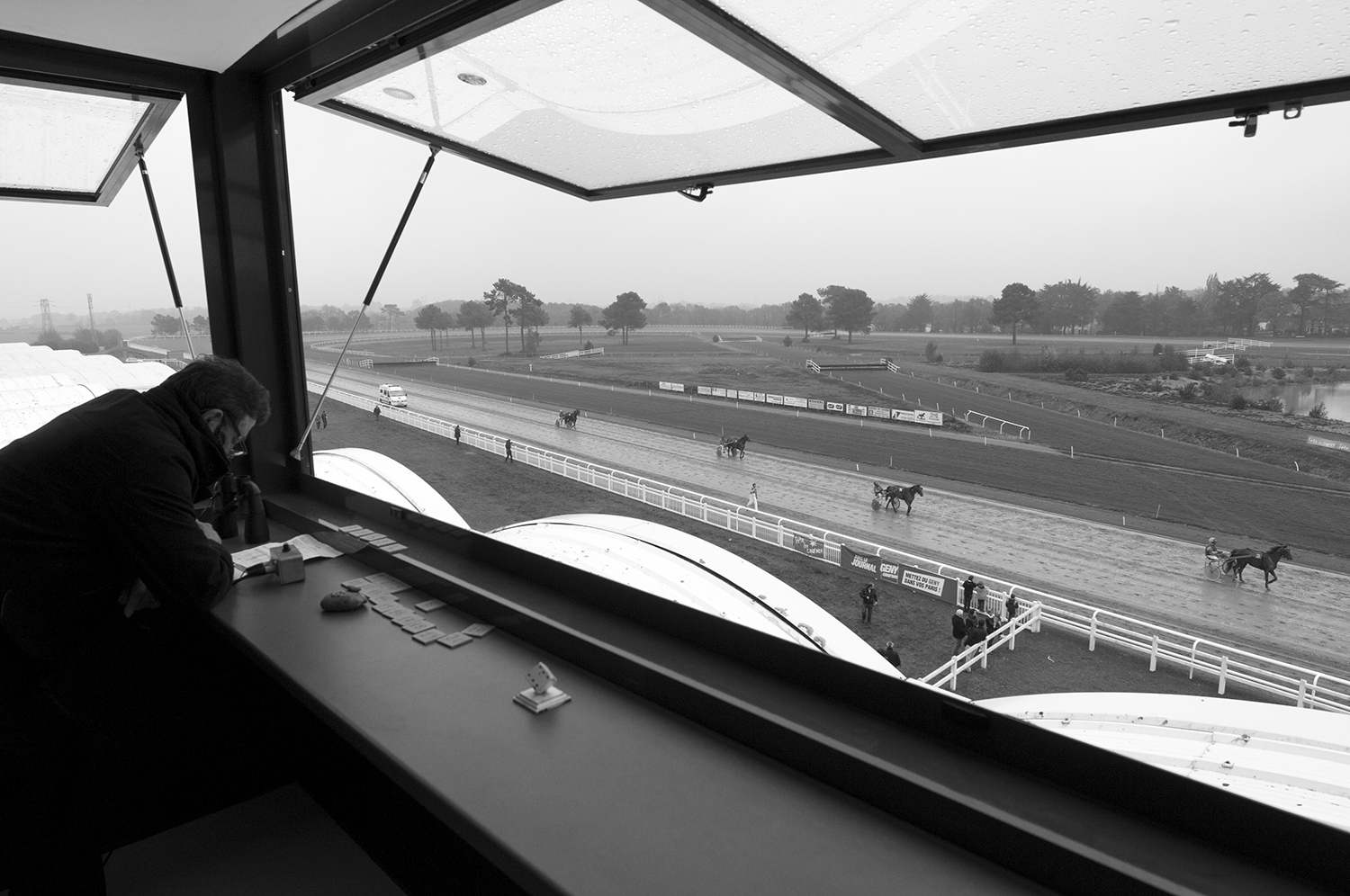 An official in the steward's tower at the Hippodrome of Pont-Château.