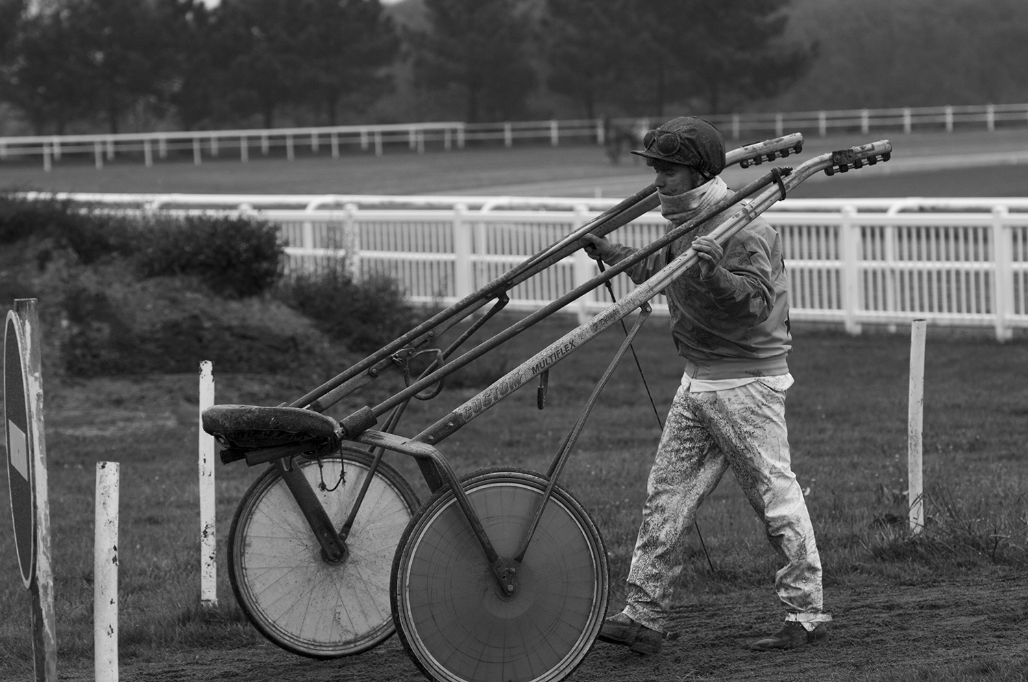 The Driver S.J.L. Tessier bringing his sulky back to the stable. 