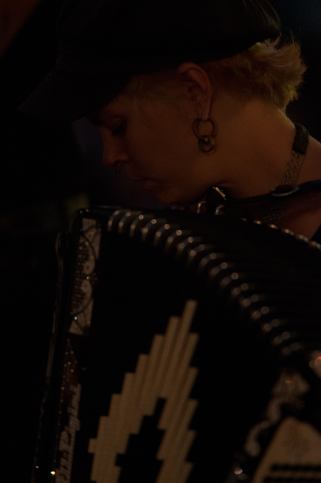 Sarah playing the accordion with the G-String Orchestra.
