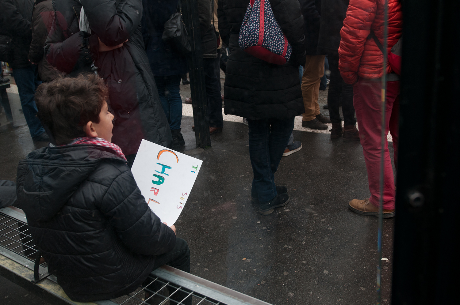 Young boy holding his "I am Charlie" sign 