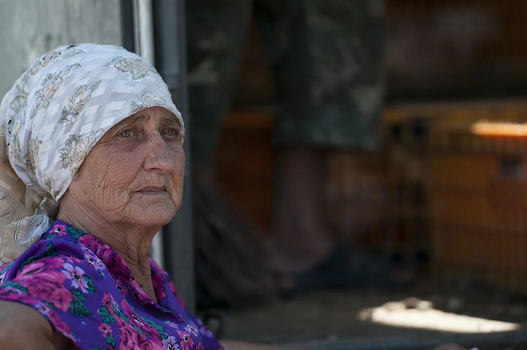 Babushka waiting for her 20 chickens