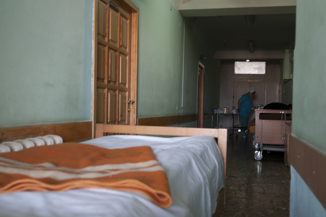 Nurse attending to a patient inside a corridora of the Emergency Hospital 10th floor.