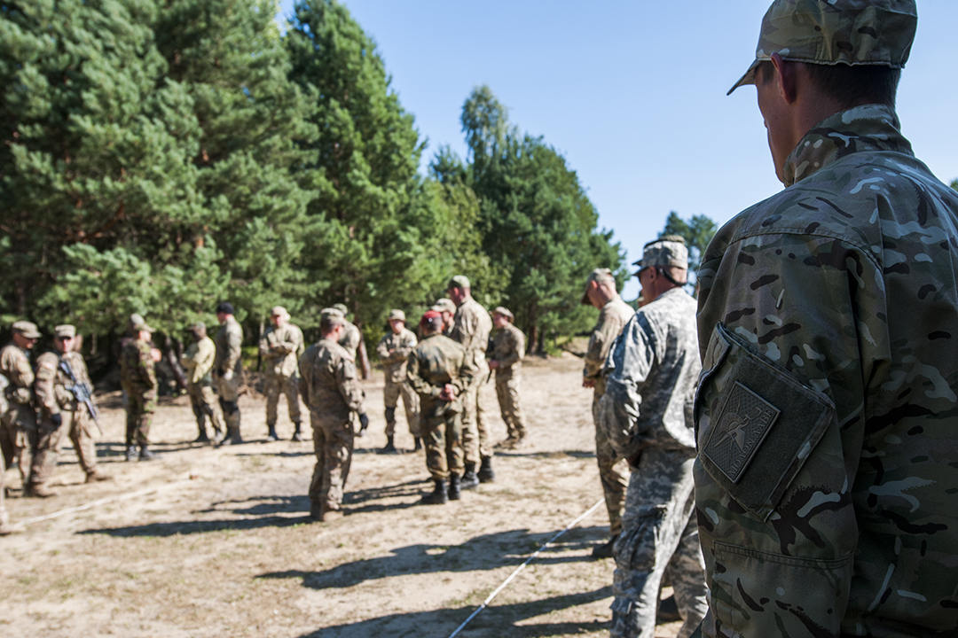 Ukrainian soldier listening to U.S. instructors.