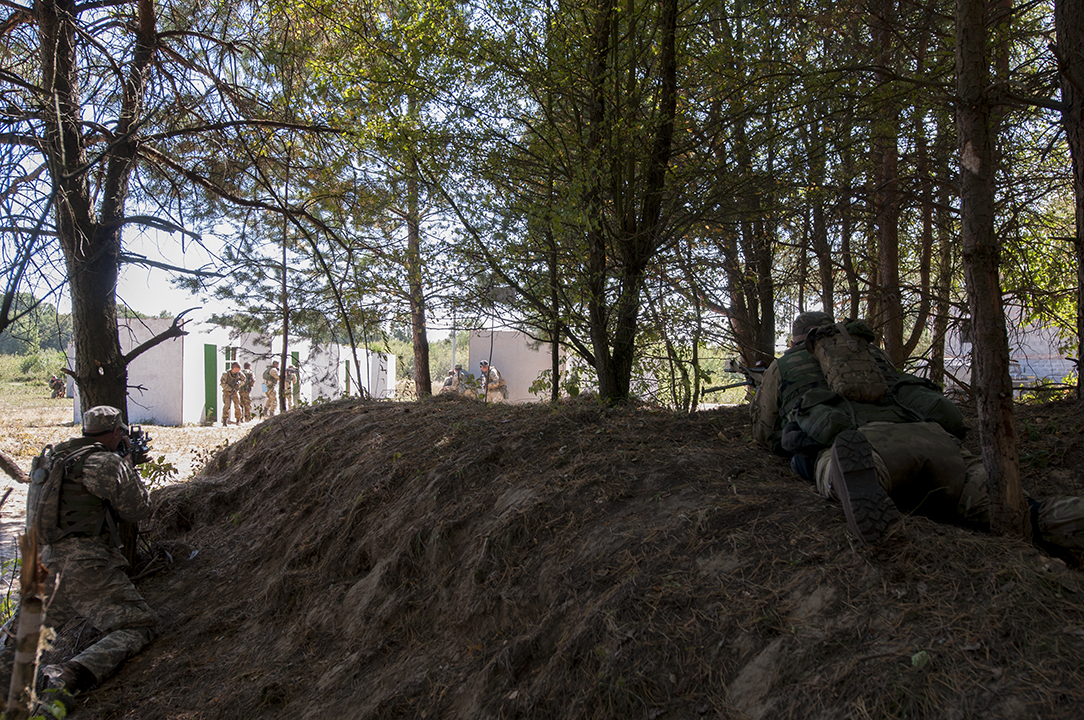 Ukrainian soldiers clearing the fake village building by building.