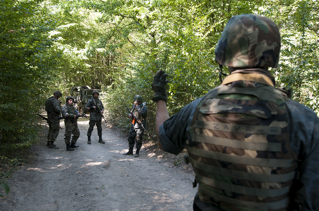 Team leader from the Ukrainian National Guard giving instruction to his soldiers at the beginning of a patrol exercise.