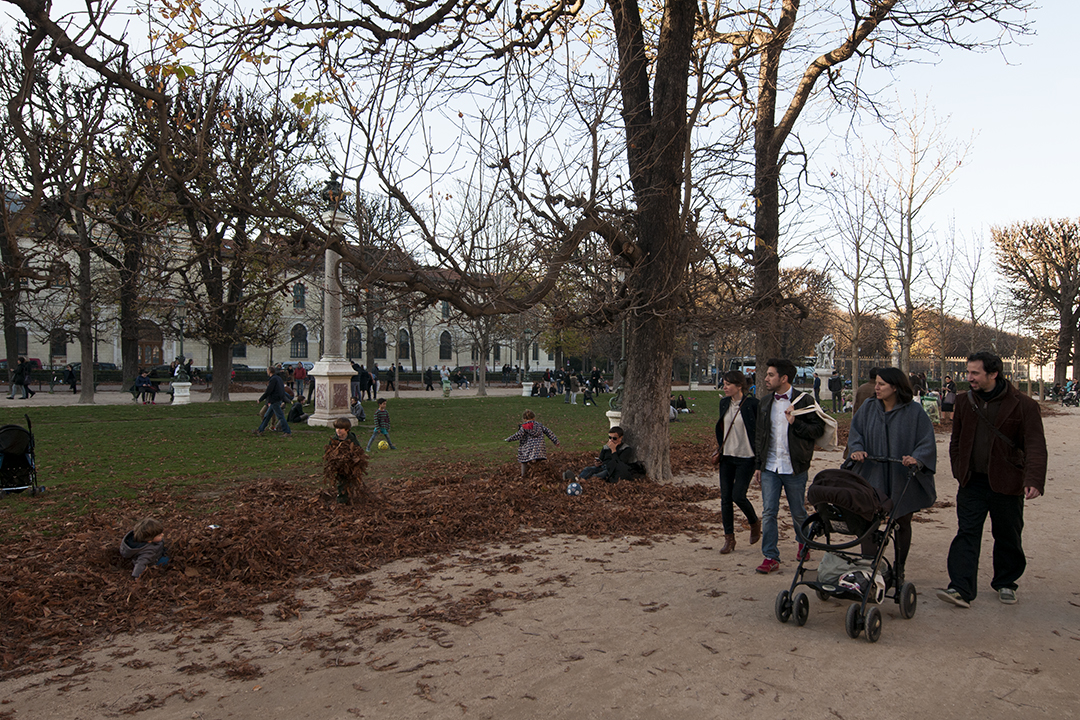 Kids playing in autumn leaves on Avenue de l'Observatoire.