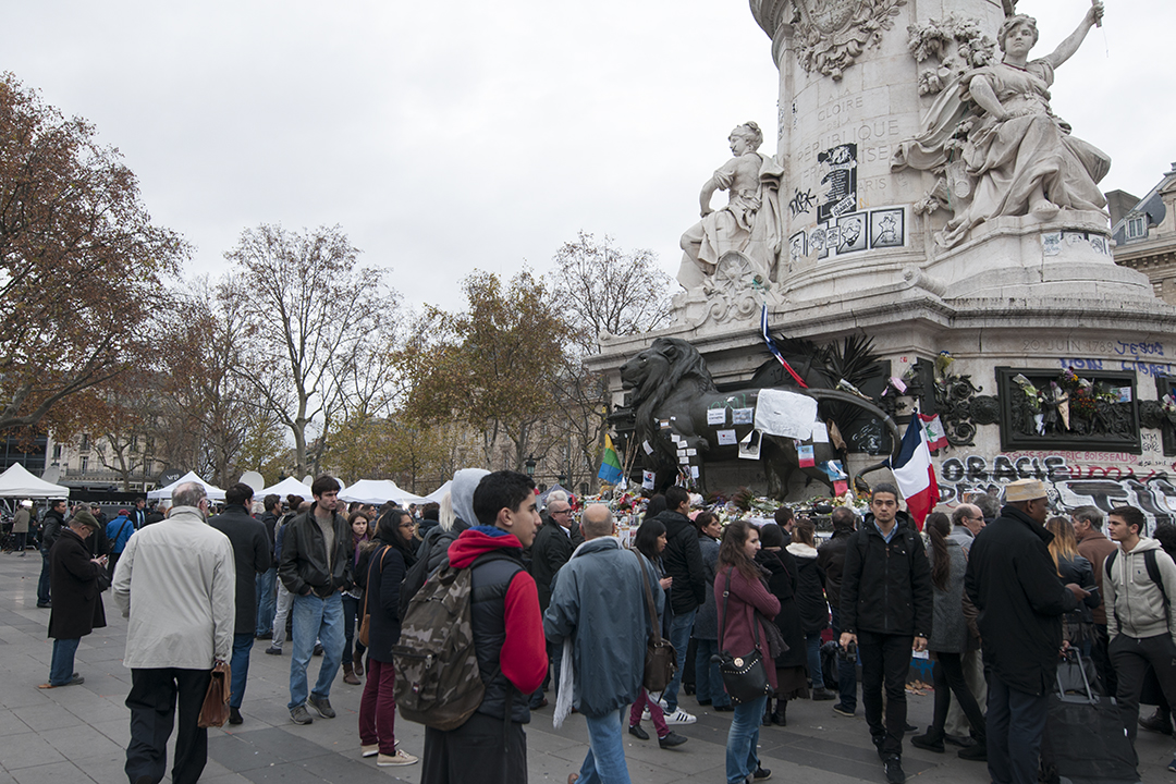 Parisians gathering around the Statue of the Republic.