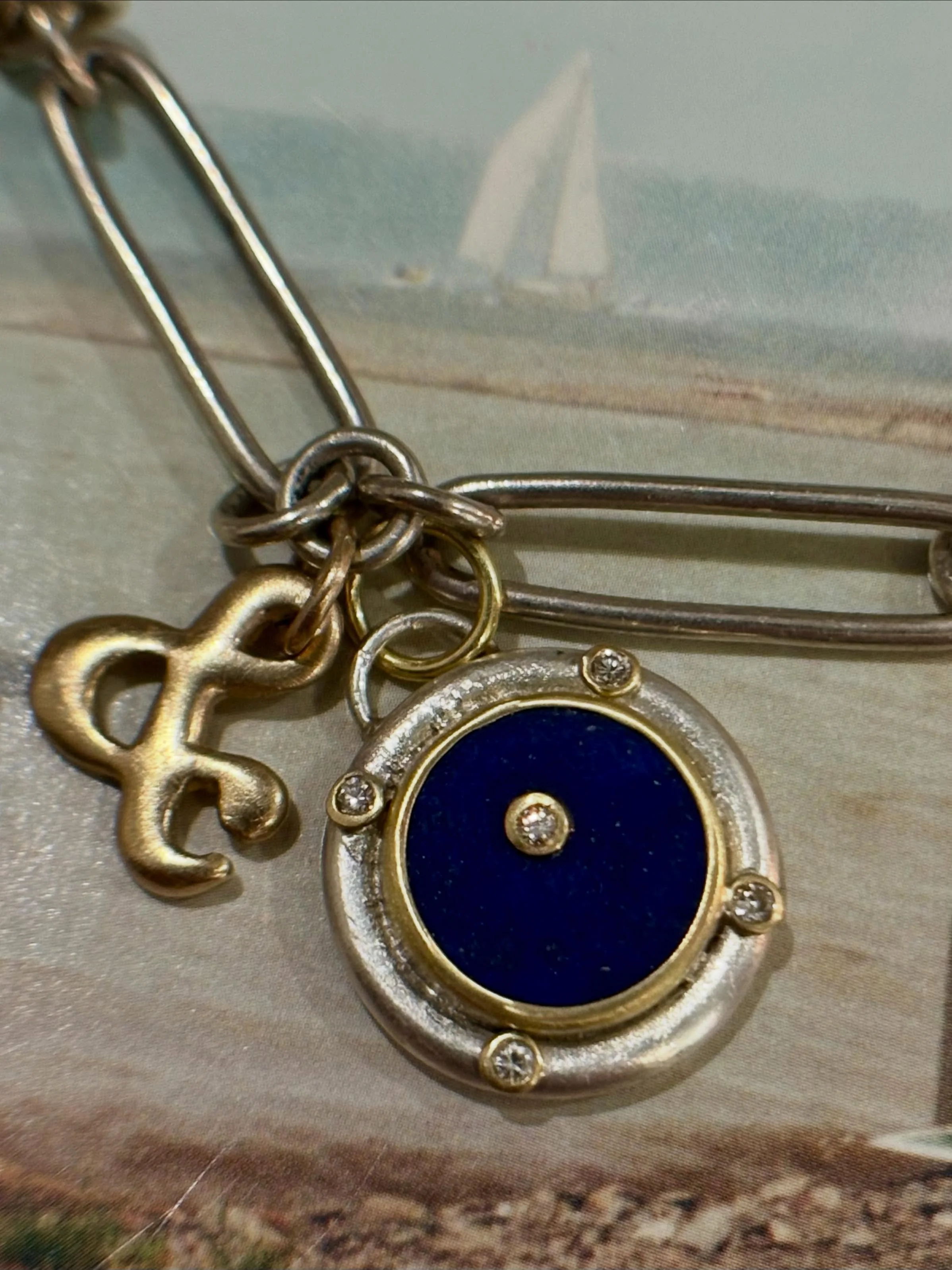 Porthole; portal. A North Star diamond set in a blue lapis sky with 4 diamonds in lieu of window rivets. If you ask Worthy, every window is a ship window in some form, a porthole. They are round, rectangular and square. I just call them portals becau