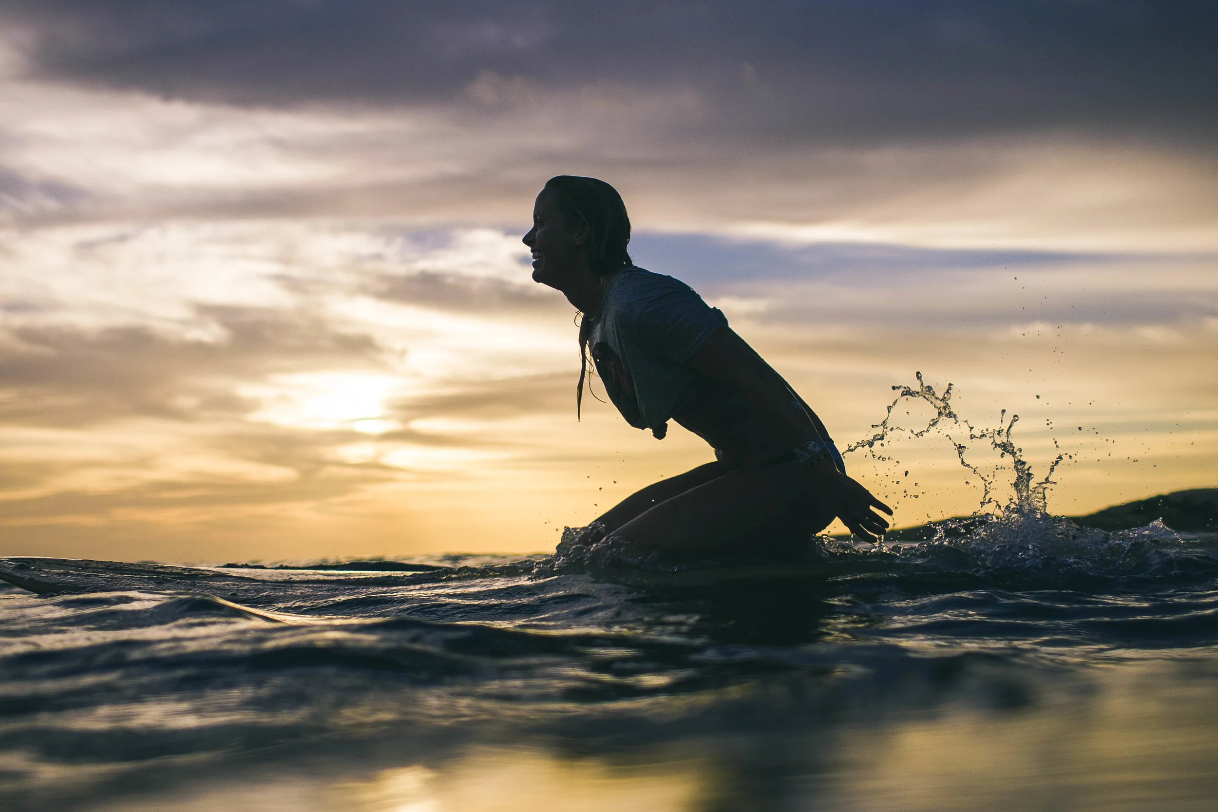 Rebekah paddling back out for just one more! 