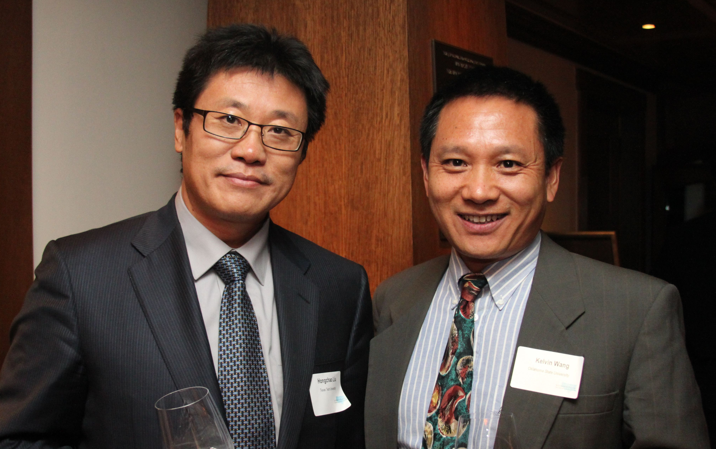 Hongchau Liu from Texas Tech University visits with Kelvin Wang, SPTC Associate Director from Oklahoma State University.