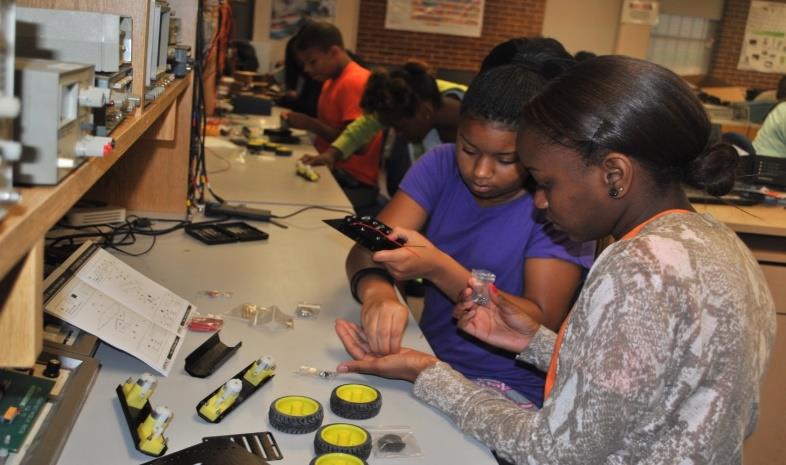 Figure 2: LUTA students assemble a robotic car