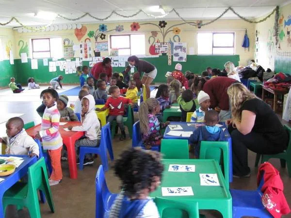 The volunteers in action along with a bunch of happy children! 