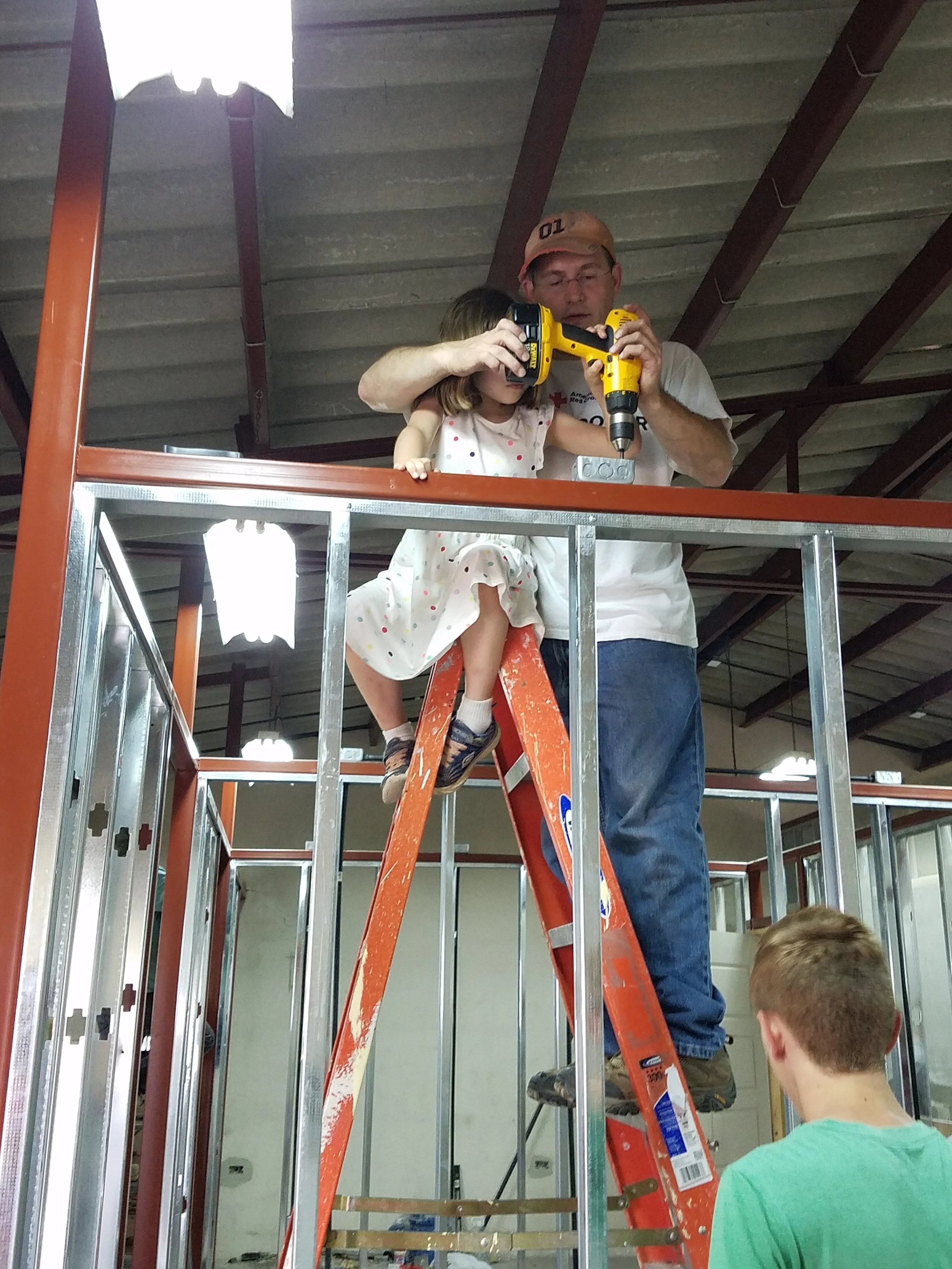 Nathan B starts the electricity with help from Ericka