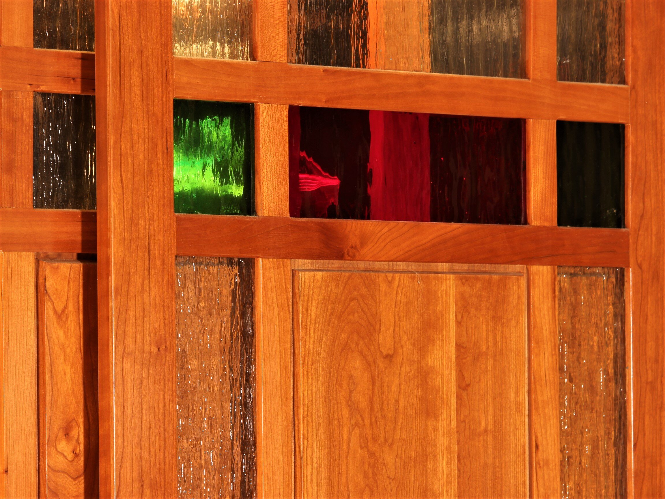 Sliding door with colored glass inserts