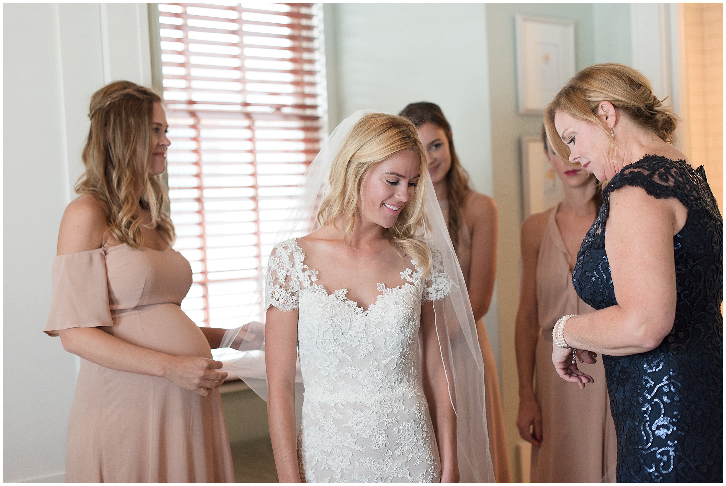 Bride getting ready shot with mom and sisters in Rosemary Beach, Florida.