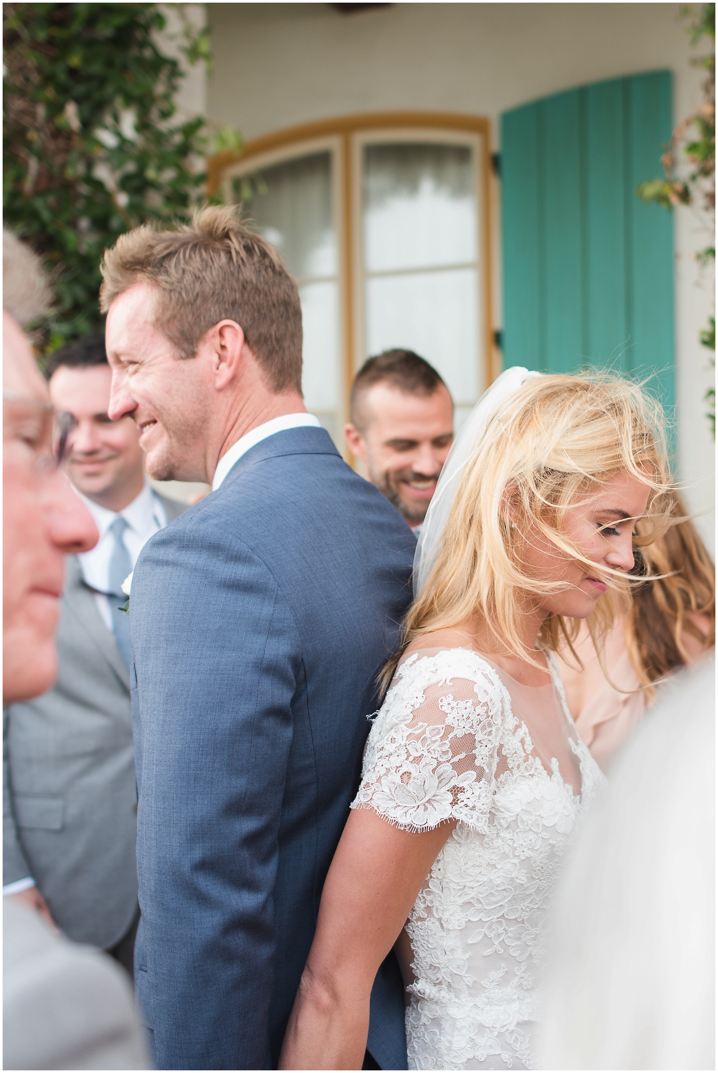 Bride and groom sharing a group prayer prior to ceremony in Rosemary Beach, Florida.