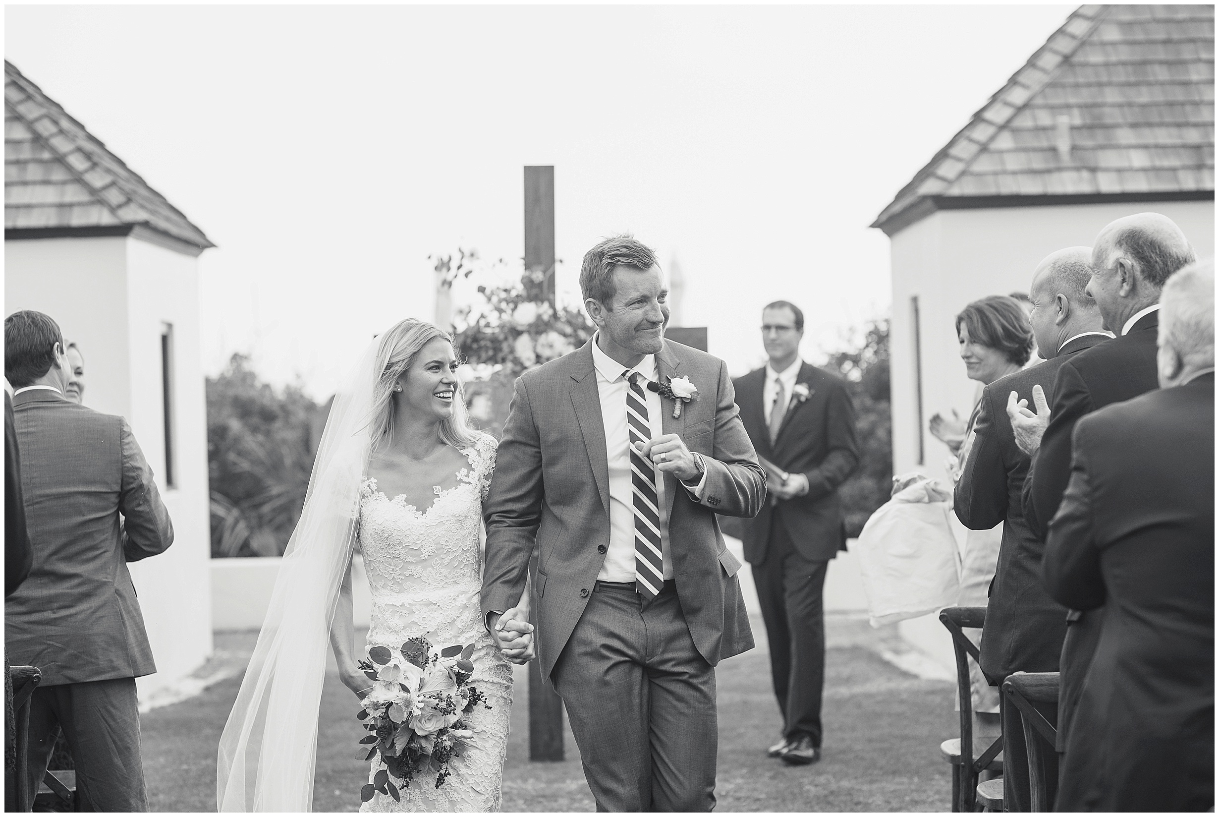 Celebratory shot of bride and groom after their first kiss.