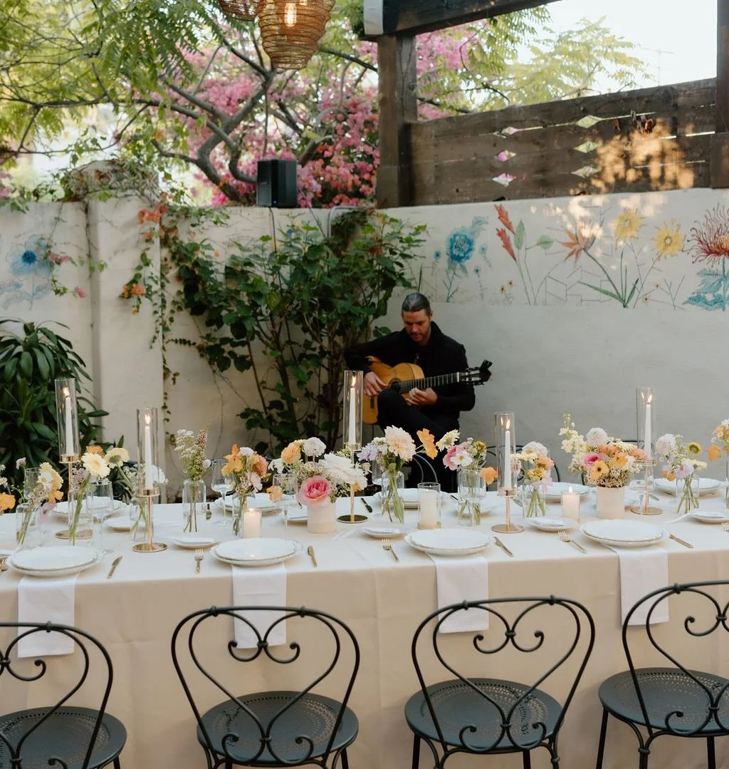 An unforgettable evening in the heart of Santa Barbara. S+S celebrated love over a Spanish-inspired dinner @loquitasb &mdash; tapas flowing, paella sizzling, and the soulful sounds of Spanish guitarist @chrisfossek setting the mood. A warm summer nig