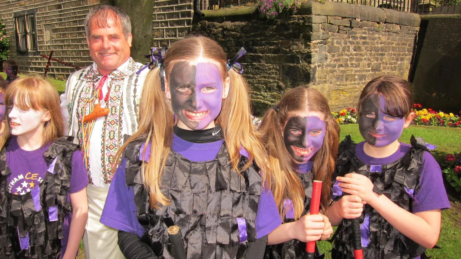 Trio participant with local children taking part in a music festival in Yorkshire.