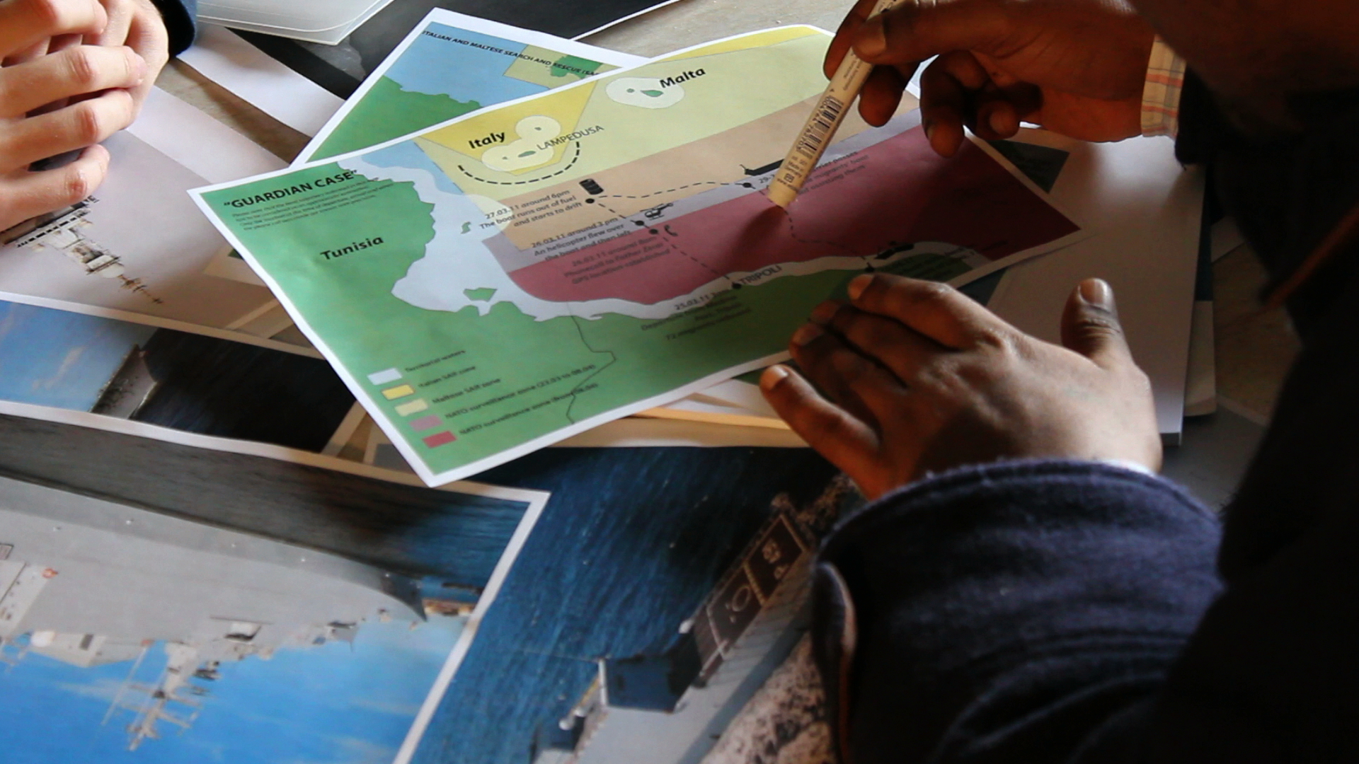 Project The Left-to-Die Boat: Still from the video interview with survivor Dan Haile Gebre, conducted by Lorenzo Pezzani and Charles Heller, Milan, 21 December 2011. In this still, we see an early sketch of the chain of events map being used to help Gebre recall the events. Image: Forensic Oceanography, 2011