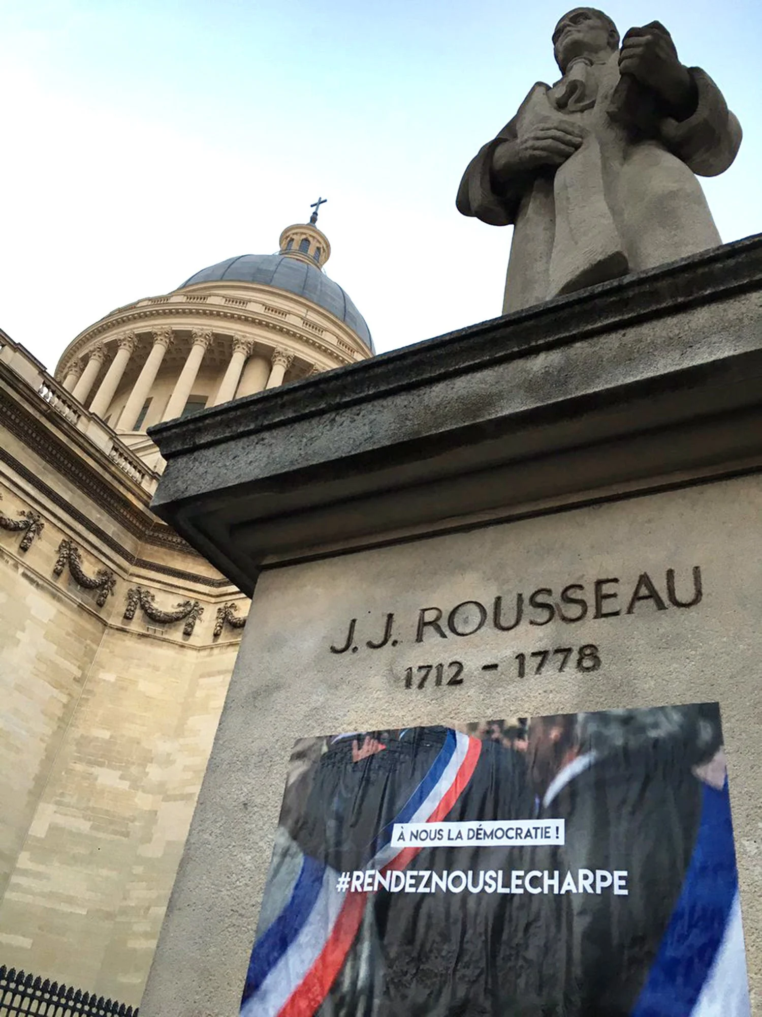 Rousseau_After a call to action by Matthieu Niango activists took to the streets of Paris and posted affiches announcing ‘A nous la démocratie!’. Photo from Twitter.