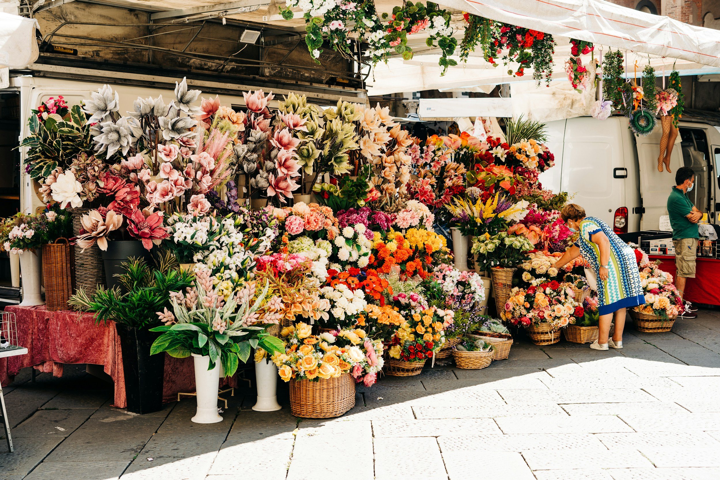 bouquets of flowers in front of a store display