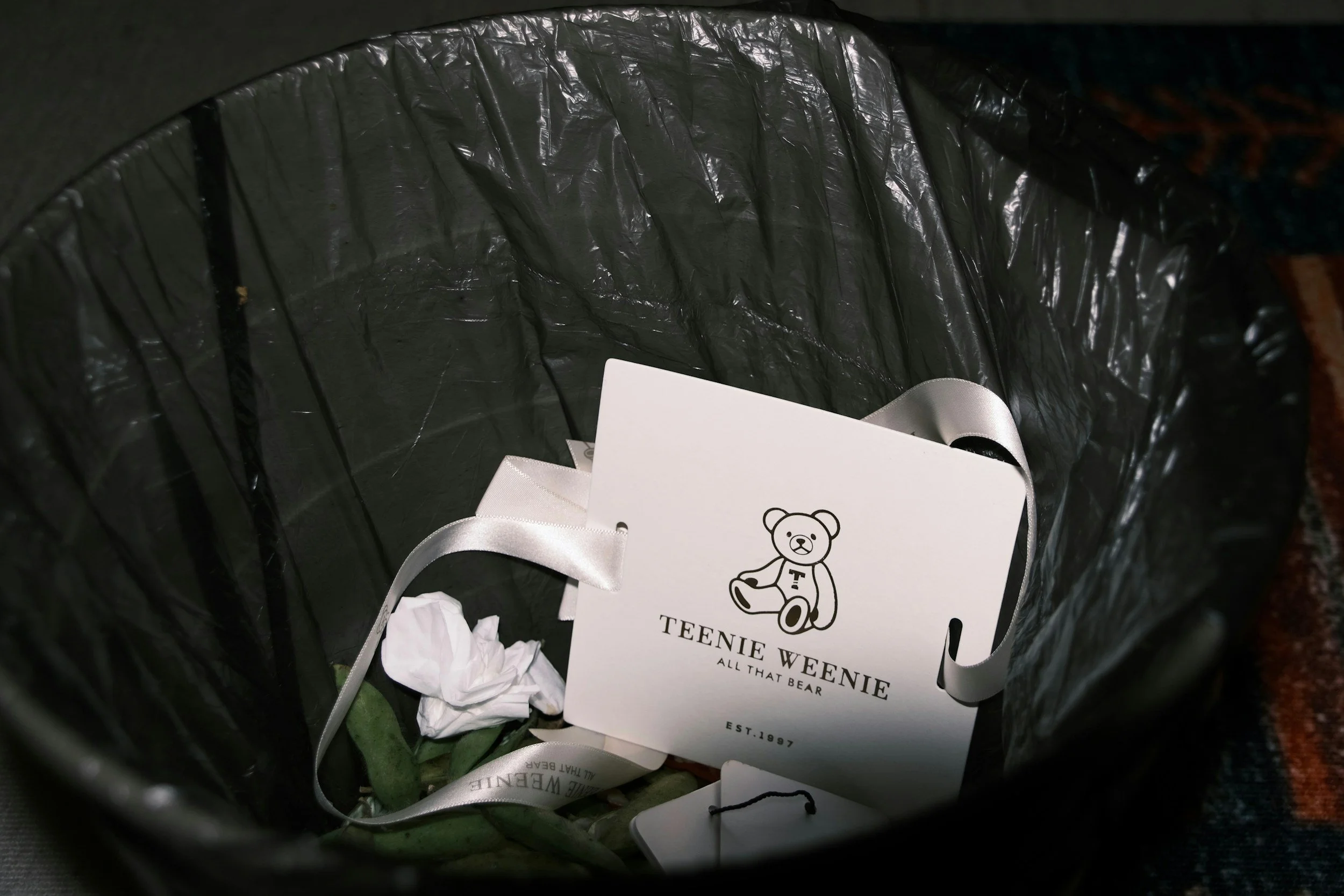 paper label and ribbon in a trash can