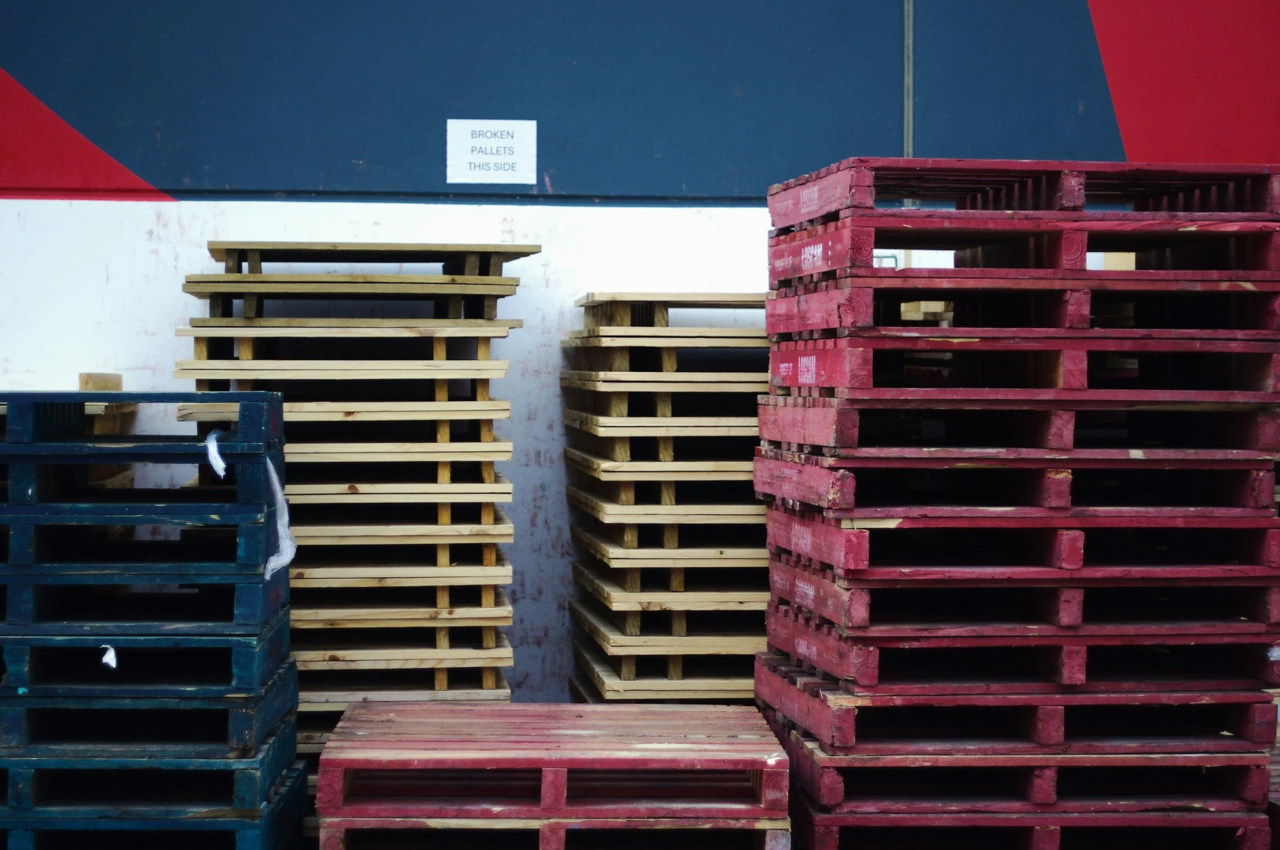 different colored pallets stacked on top of each other