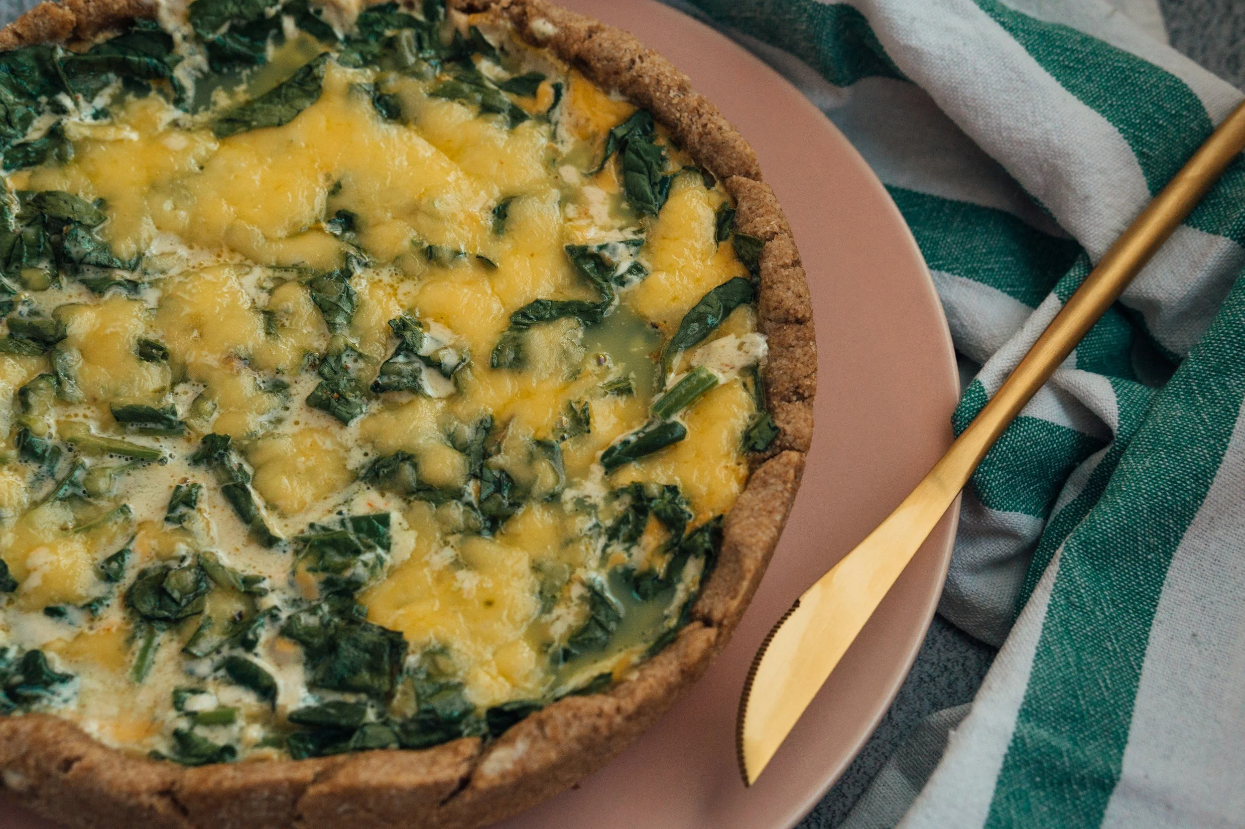 quiche Florentine on a brown plate