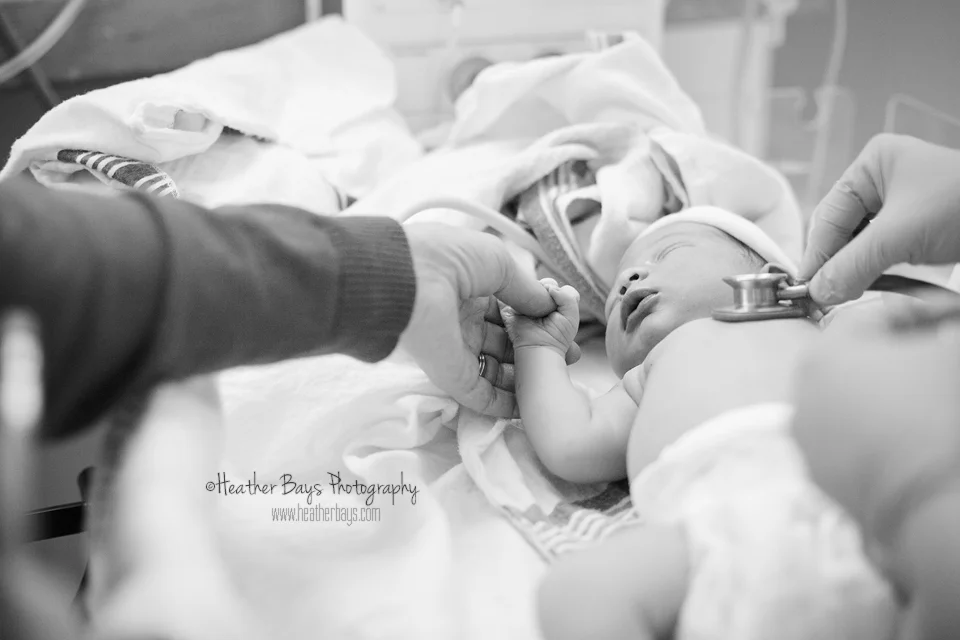 Holding Grandma's hand.