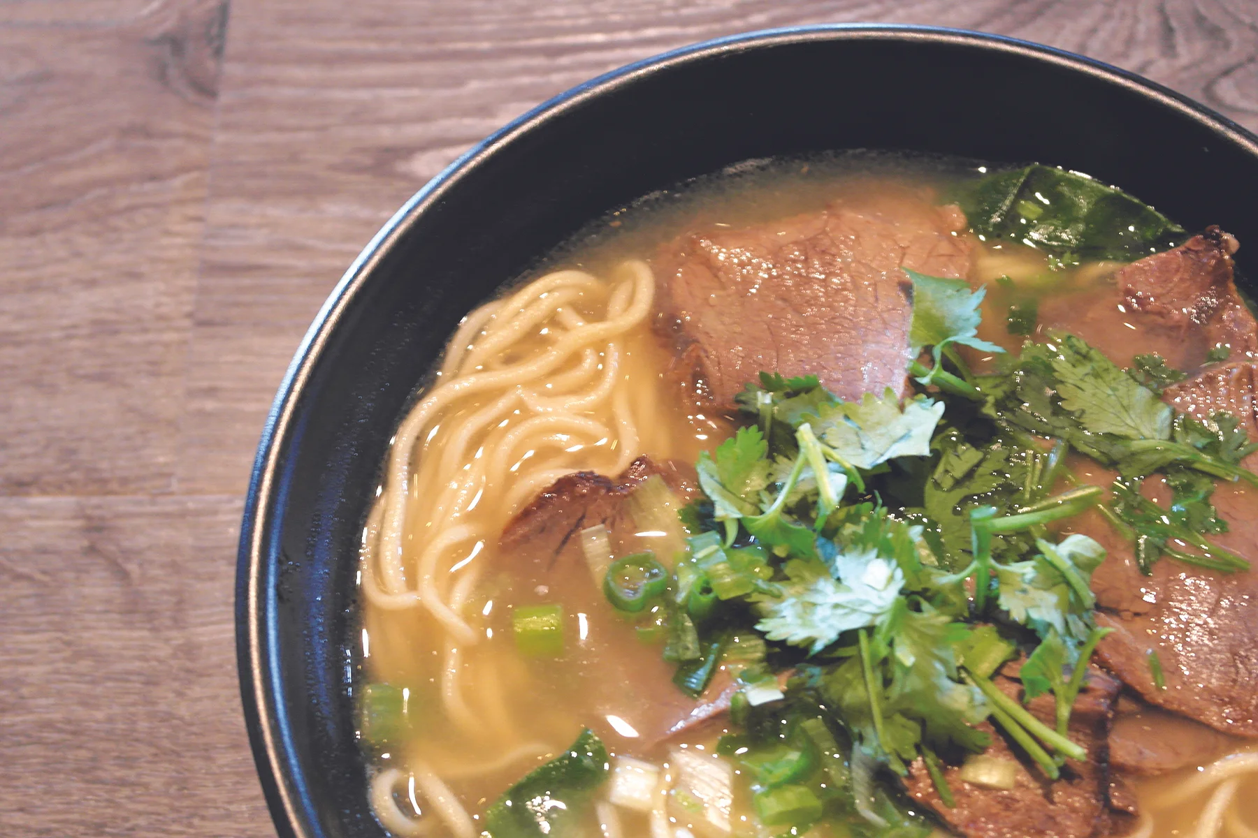 My beef noodle bowl had a rich broth, juicy slices of beef, scallions, and mild yet flavorful noodles.