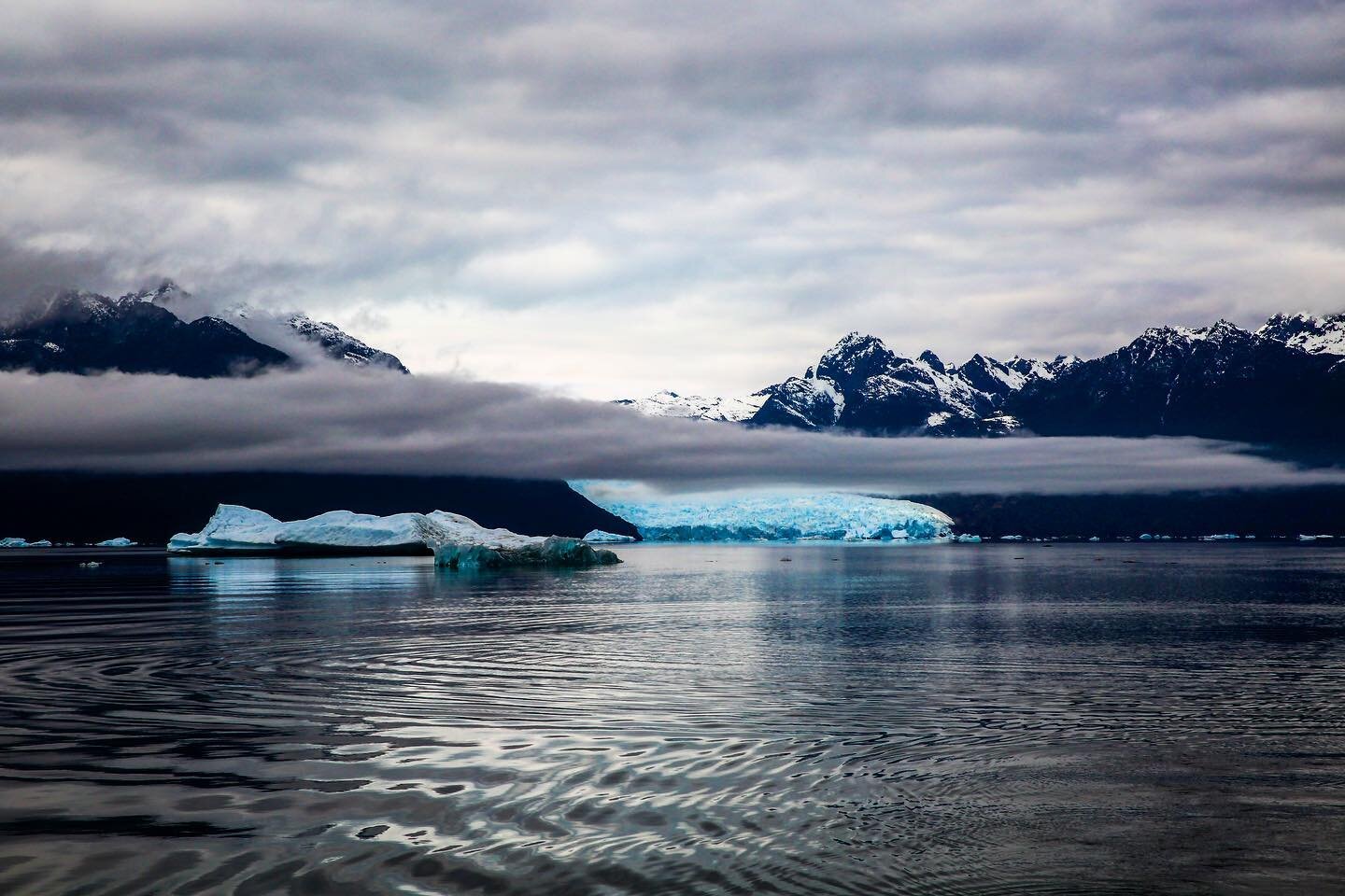 &lsquo;Retreating Glacier&rsquo; part of a limited edition series was taken from a boat. I was struck by the peace and tranquility, such immensity makes you reassess your importance in the world. I love how the low hanging thin cloud almost sits alon