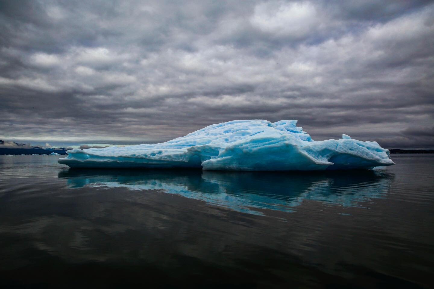 &lsquo;Iceberg II&rsquo; fine art photography available to buy. There is something very magical about glacial ice. This iceberg was sleeker than the first and it was something about its shape that captured me. It was a sylph like sculpture floating i