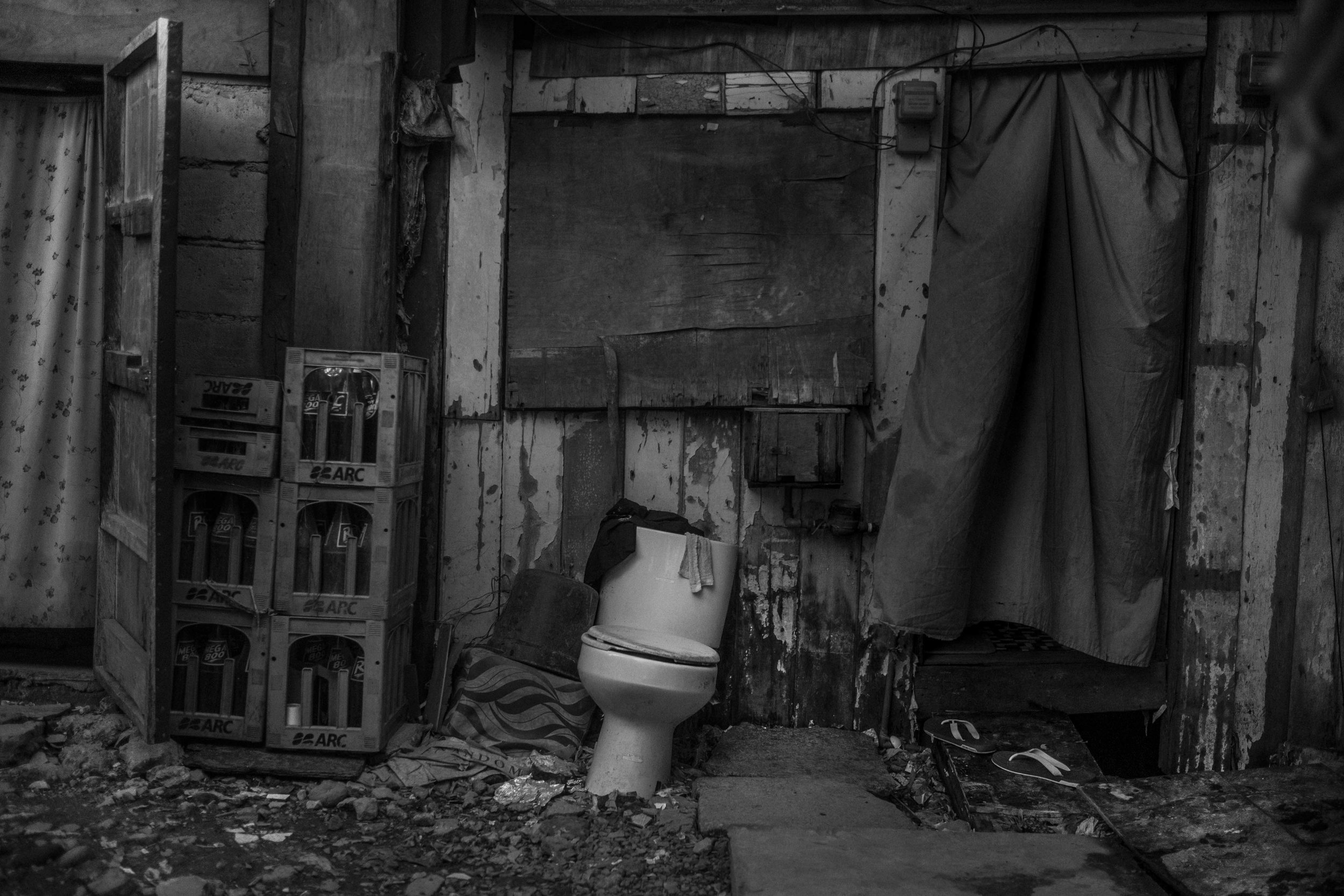  A toilet that is not used because there’s no sewage is seen outside a house in Baseco. 